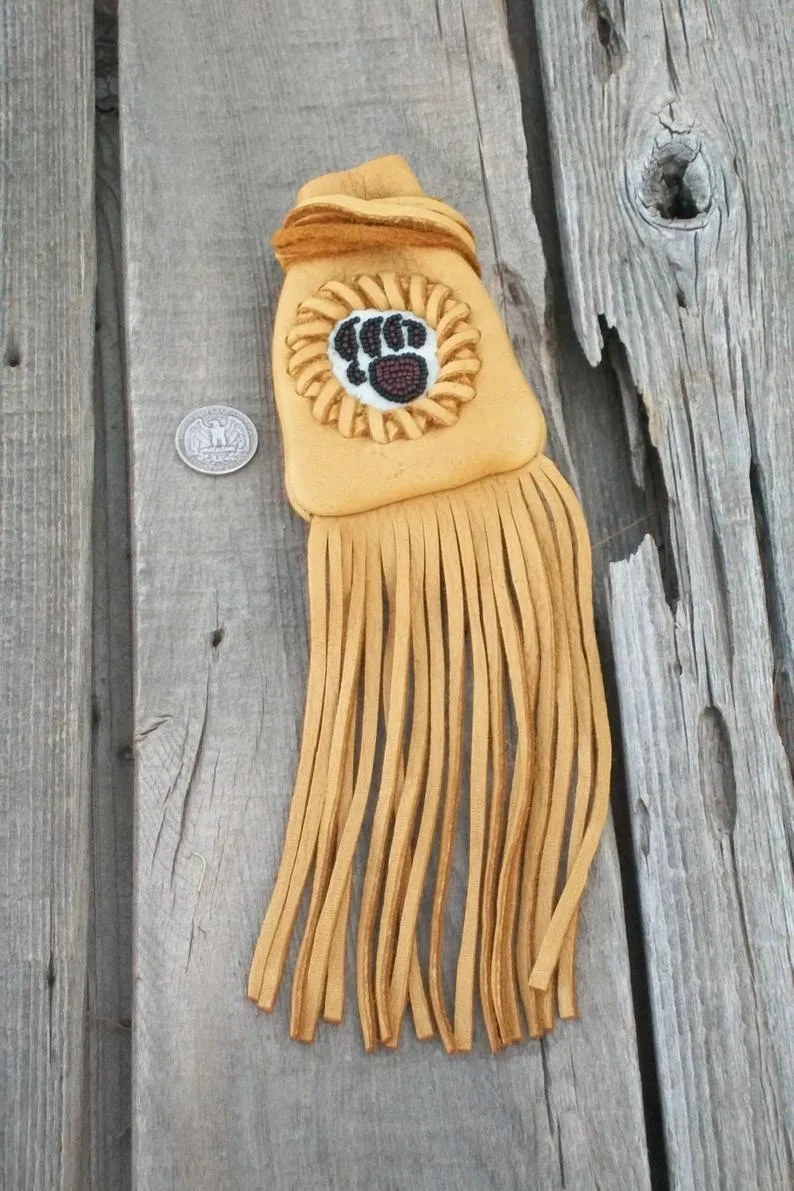 Fringed medicine bag with bear paw totem, leather neck pouch